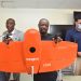 MD of ECG, Kwame Agyeman-Budu [middle] showing the Drone to the audience