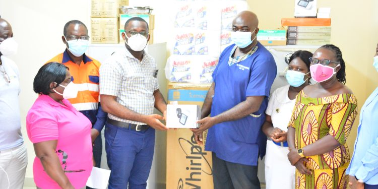 Dr Annor (left) presenting items to Medical Superintendent (right)