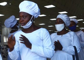 Members of the Celestial Church of Christ wear a one-piece white garment made from flammable fabric