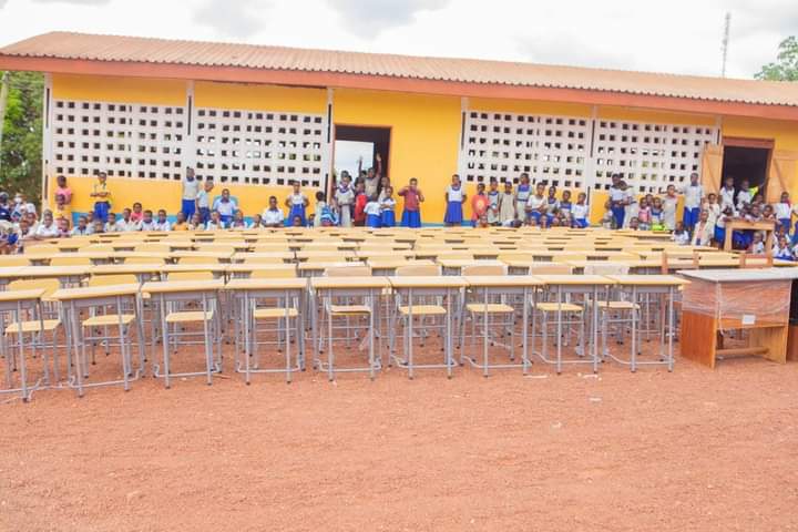 Western North Regional Minister presents desks to basic students