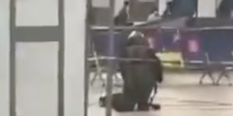 Video circulating online from the airport showed a man in an Explosive Ordnance Disposal outfit