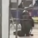 Video circulating online from the airport showed a man in an Explosive Ordnance Disposal outfit