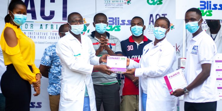 Dr. Foster Amponsah, (2nd left) Clinical Director, Koforidua Regional Hospital receiving the medicines from Madam Sandra Awuah Nyanor, Medical Rep, Bliss GVS Pharma Ghana (2nd Right).