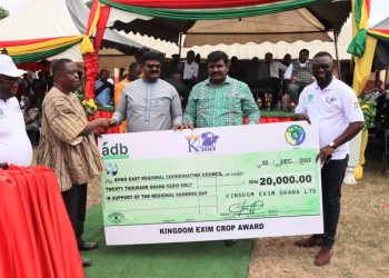 Dr. James Rajamani, CEO of Kingdom Exim Group supported by the Dr Emmanuel Rajamani (MD) presenting a dummy cheque to the Bono East Regional Minister (In smock) during the 38 Regional farmers day in Atebubu