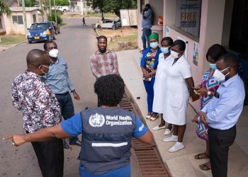 WHO official, Ama Owusu-Asare interacts with staff members during a tour at the Takoradi Hospital on August 3, 2022