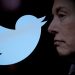 FILE PHOTO: Twitter logo and a photo of Elon Musk are displayed through magnifier in this illustration taken October 27, 2022. REUTERS/Dado Ruvic/Illustration//File Photo
