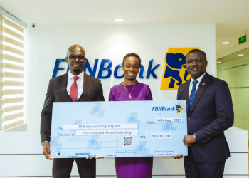 FBNBank Ghana MD/CEO, Victor Yaw Asante and Treasurer, Grace Isaac-Aryee presenting the cheque to Abubakar Sulemana