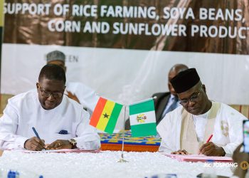 (L-R) Rev. George Tsidi Blavo, lead Coordinator, Jospong Rice Project together with Mr.   Aminu Mohammed Gorony, RIFAN president and executive of EGTA Investment Ltd signing the MoU at a short ceremony in Nigeria.