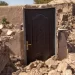 A solitary door is all that remains of a building in Herat after the Saturday's quake