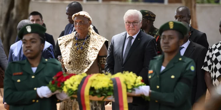 German President Frank-Walter Steinmeier lays a wreath at the monument in Songea's Memorial Park together with descendants of the heroes of the Maji Maji War on November 1, 2023.