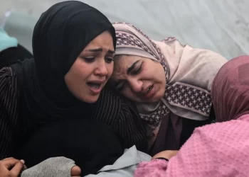 Women at Al-Aqsa hospital in central Gaza mourn their loved ones killed in what Hamas says was an Israeli strike on the Al-Maghazi refugee camp on Sunday
