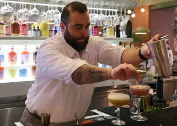 A bar tender mixes a non-alcoholic cocktail at a pop-up bar in Riyadh. But the real stuff could soon be heading to the Saudi capital.