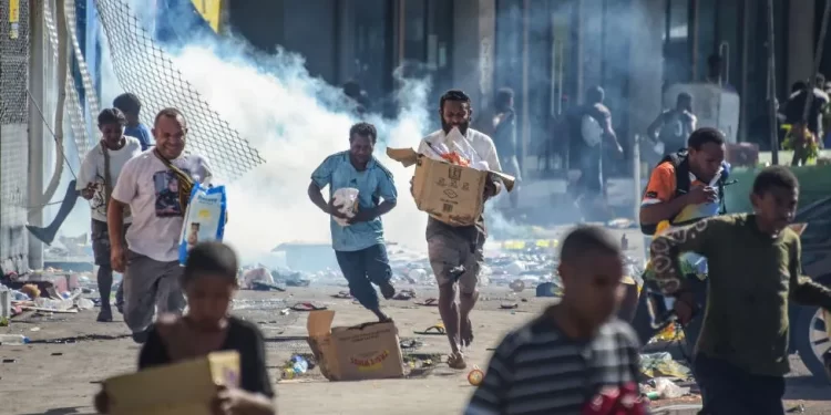 Shops and cars were set on fire and supermarkets looted across the city