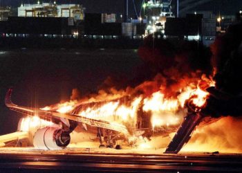 Japan Airlines Flight 516 in flames at Haneda Airport