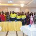 Newmont and Project C.U.R.E officials with health professionals