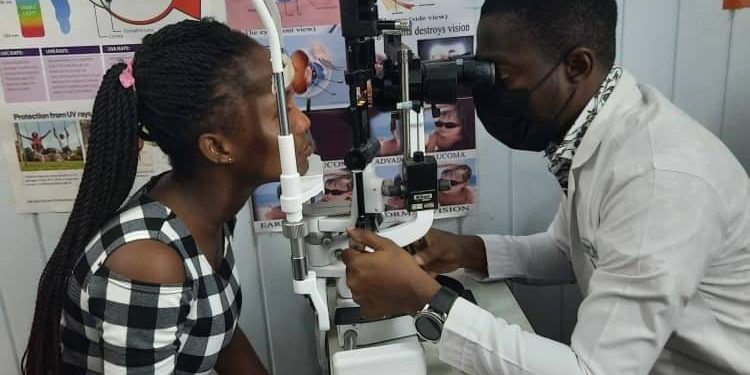 Dr Ampiah examining a patient's eye