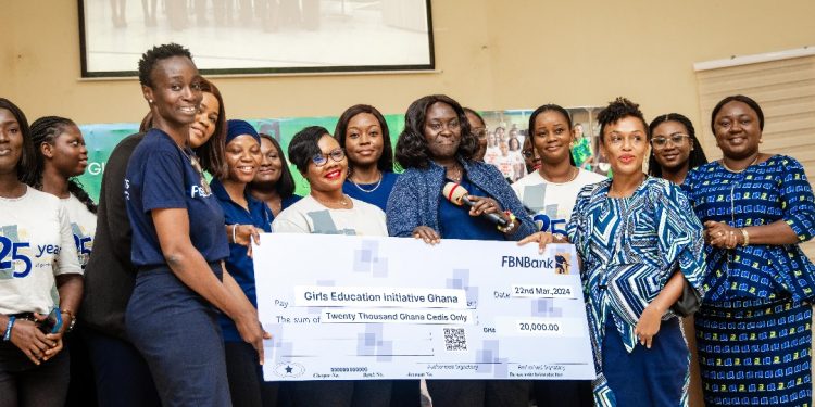 Grace Isaac-Aryee, Treasurer & Chairperson of FBNBank Women Network presenting the cheque to Elizabeth Akua Nyarko Patterson, Executive Director of GEIG