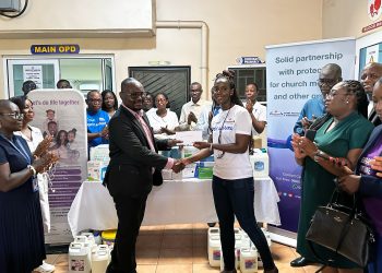Kakra Duffuor-Nyarko (right), CEO of StarLife Assurance, presenting the items and a cheque to Dr. Emmanuel Kafui (left), a Senior Medical Officer at the Pentecost Hospital, Madina.